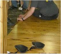 Picture - Inspecting Australian Cypress flooring..
